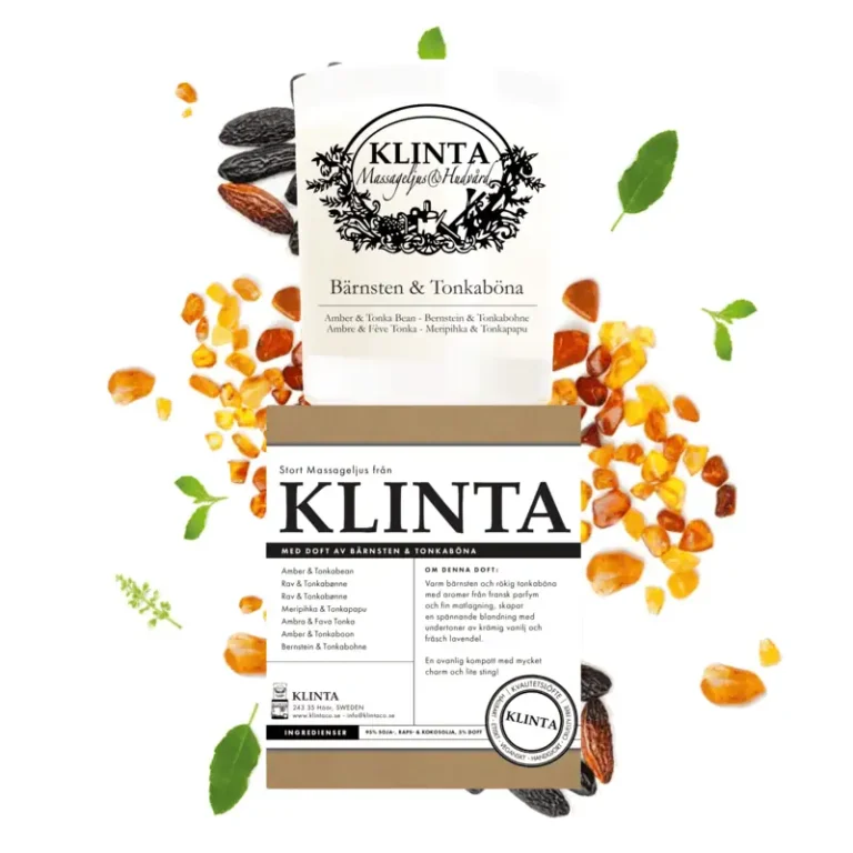 Klinta massageljus Bärnsten & Tonkaböna med tillhörande förpackning omgiven av tonkabönor, bärnsten och gröna blad.