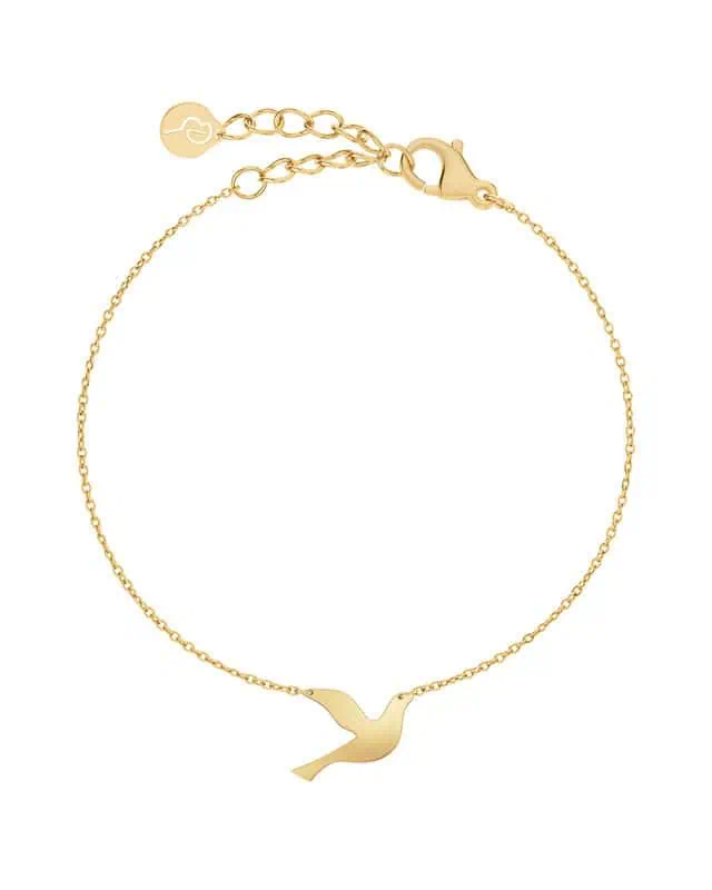 Guldpläterat armband från Edblad med tunn kedja och fågelmotiv i mitten samt justerbart lås.