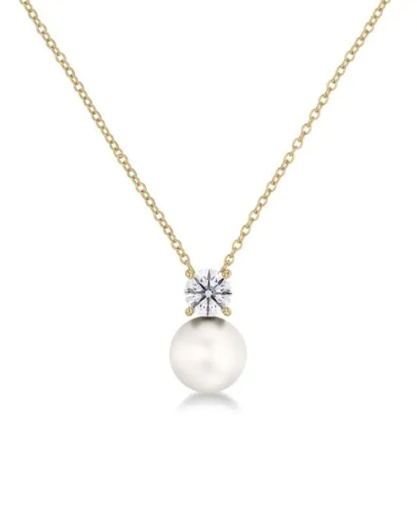 Edblad halsband i guld med pärla och klar sten på fin kedja.