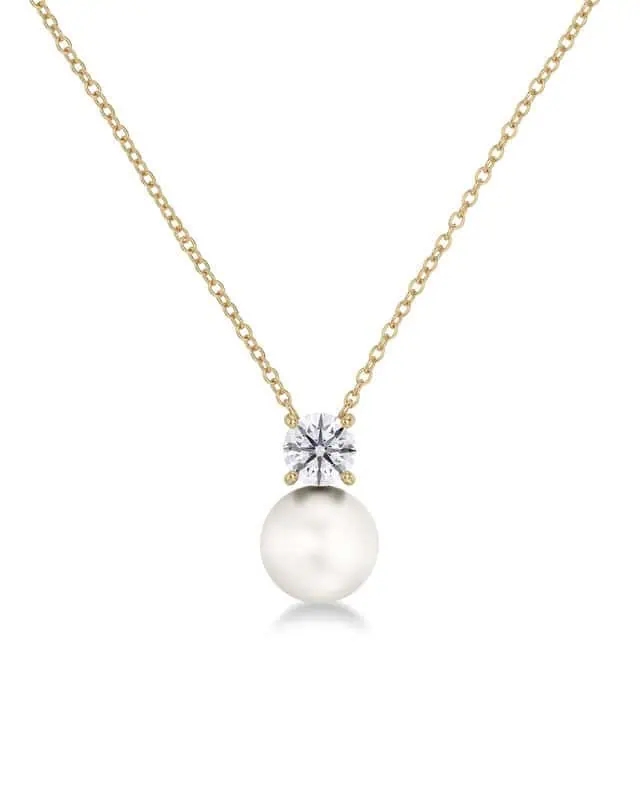 Edblad halsband i guld med pärla och klar sten på fin kedja.