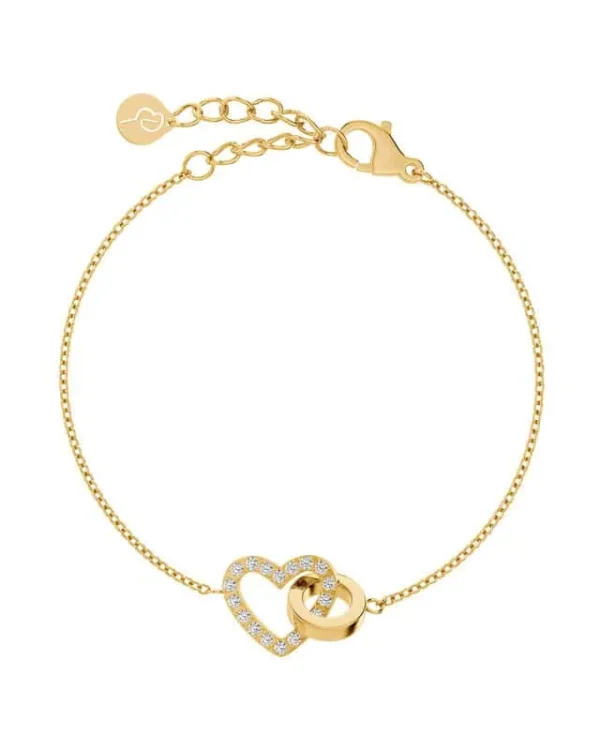 Armband i guld med hjärta dekorerat med klara stenar och en slät ring, från Edblad. Justerbar kedja med lås och logoberlock.
