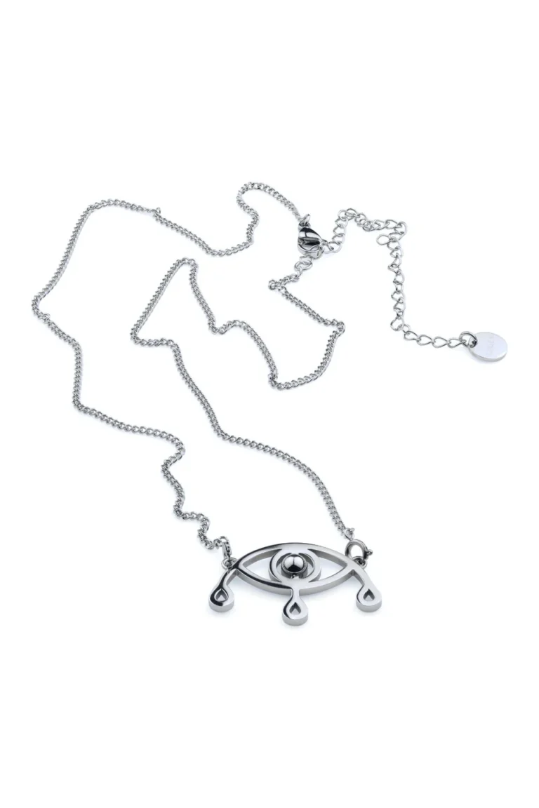 Voyance halsband i rostfritt stål med öga och tre tårar, liggande mot vit bakgrund.
