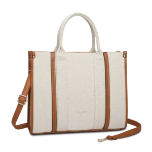 Beige tote bag i textil och veganskt läder från Puccini med konjaksbruna detaljer och justerbar axelrem.