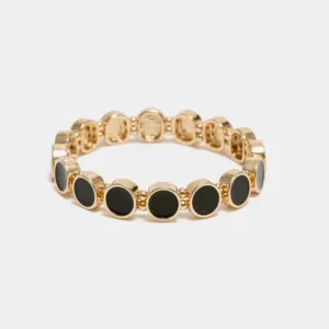 Ava Petite Elastic Bracelet – guldfärgat elastiskt armband med svarta ovala detaljer och modern design.